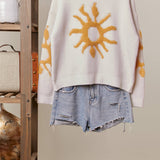 Cozy Knit Sweater with Bold Yellow Sun Patch