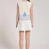Knitted Vest With A Blue Sailboat Pattern Paired