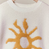 Cozy Knit Sweater with Bold Yellow Sun Patch