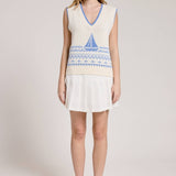 Knitted Vest With A Blue Sailboat Pattern Paired