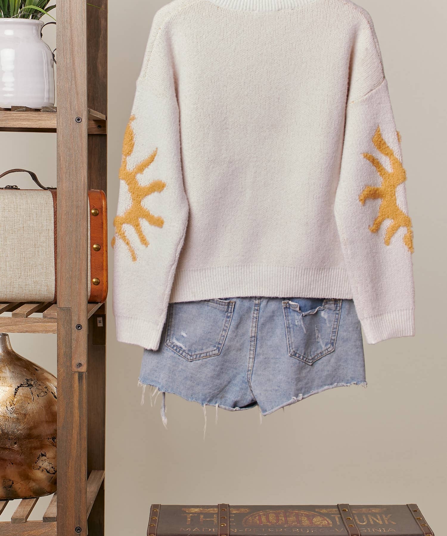 Cozy Knit Sweater with Bold Yellow Sun Patch