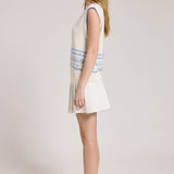 Knitted Vest With A Blue Sailboat Pattern Paired