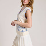 Knitted Vest With A Blue Sailboat Pattern Paired